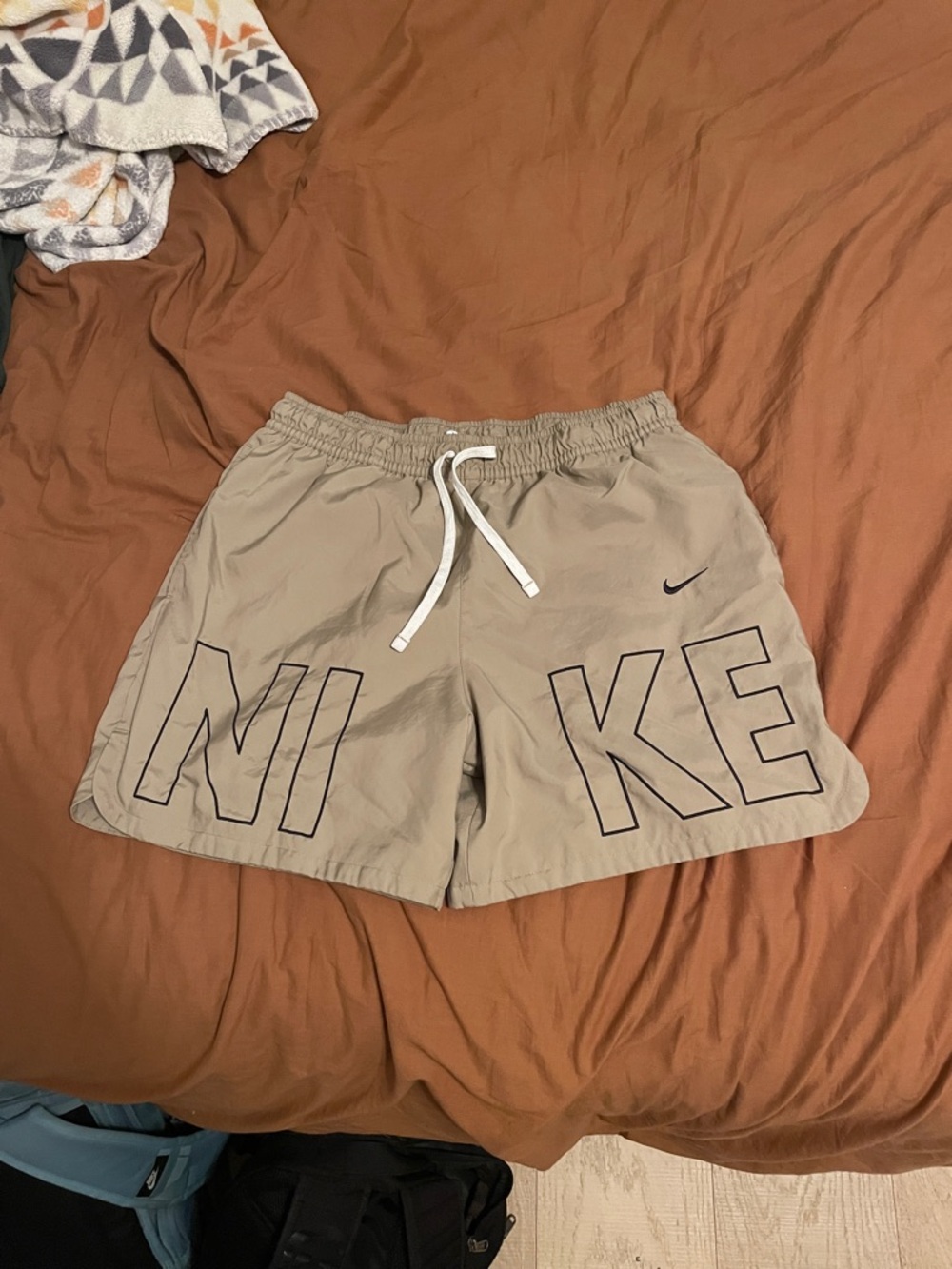 Men's tan  Nike Sportswear Embroidered Woven Flow Shorts